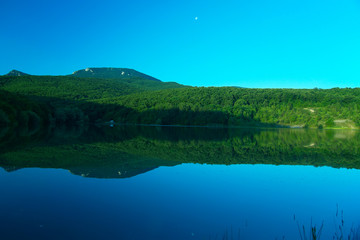 Mountain lake in Crimea at early morning .