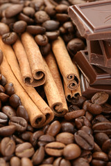 Obraz na płótnie Canvas arrangement of chocolate coffee and cinnamon sticks