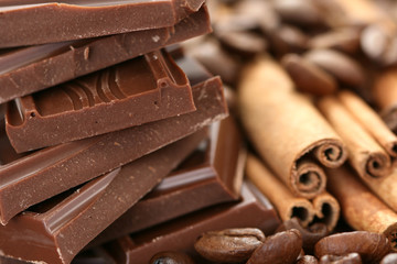 arrangement of chocolate coffee and cinnamon sticks