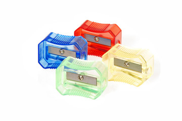 Four transparent colored plastic pencil sharpener
