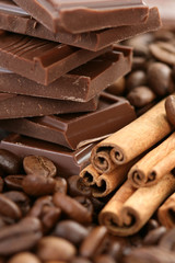 arrangement of chocolate coffee and cinnamon sticks