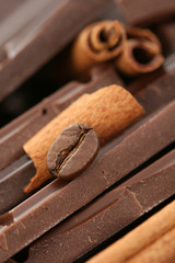 arrangement of chocolate coffee and cinnamon sticks
