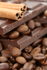 arrangement of chocolate coffee and cinnamon sticks