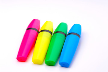 four colorful markers isolated on white background..