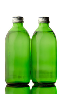 two bottles  green color with mineral water