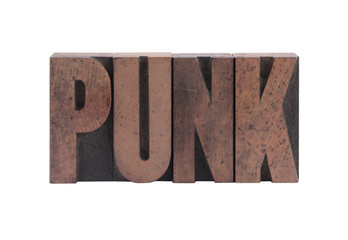 the word 'punk' in old, ink-stained wood type
