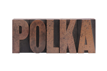 the word 'polka' in old, ink-stained wood type