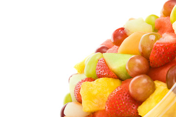 Fresh chopped fruit salad, isolated on white with copyspace.