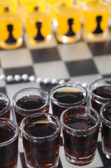 chess figures made up of glasses with drinks