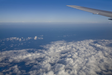 Fototapeta na wymiar Ocean outside a jumbo jet plane window