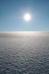 snow surface with blue sky............