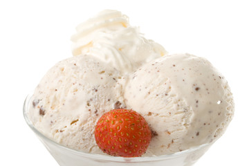 Ice-cream with a strawberries in a glass on a white background.
