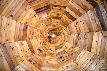 Fototapeten The ceiling of a wooden gazebo resembles a spiderweb pattern © Raver32