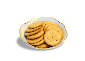 Little bowl with crackers standing on white background