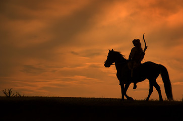 Horsemen riding on the sunset