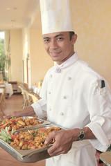 chef carrying food at restaurant