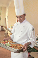 chef carrying food at restaurant