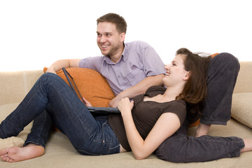 casual couple together on sofa