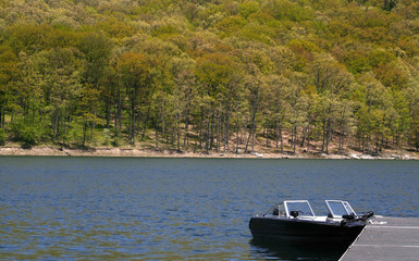 Fototapeta na wymiar Single Boat In The Lake