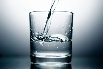 Water pouring into a Glass.