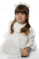 Fototapeta na wymiar The girl in a white dress
