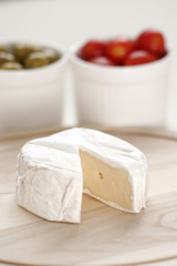 Breakfast with cheese, olive and tomato .