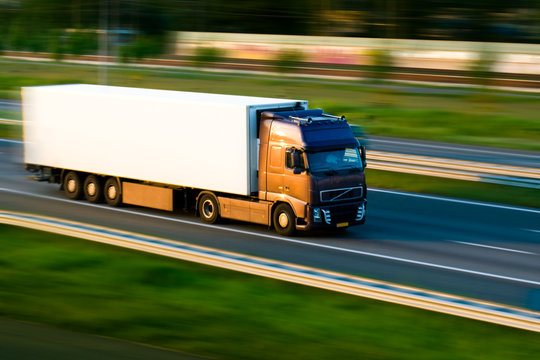 Freight truck on motorway. Motion blur