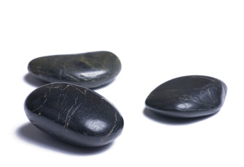 Fototapeta na wymiar Black stones isloated on a white background
