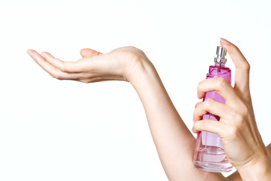 Woman Applying Perfume On Hand Wrist