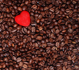 red heart in the heap of brown coffee seends