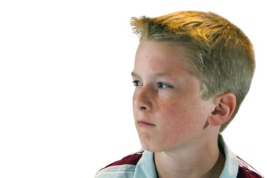 Blond Haired Boy Looks Suspicious