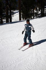 beginner boy on skis learning