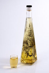 Herb brandy glass and bottle