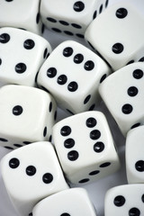 White gambling dices thrown on white background