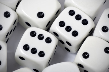 White gambling dices thrown on white background