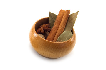 spices in wood container isolated