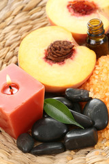 Fototapeta na wymiar peaches bath with bath salt essential oil and fresh fruits