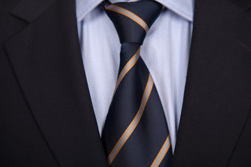 detail of a business man suit with blue tie