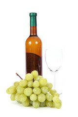 Bottle of white wine and glass with grapes on white background