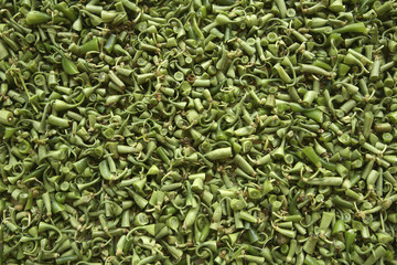 Background of green bush bean tops and tails