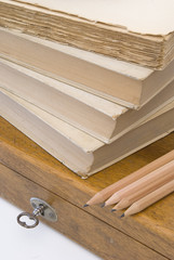 Vintage background with old books and wood box