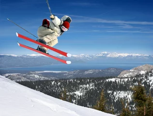  A young man jumping high at Lake Tahoe resort © Galina Barskaya