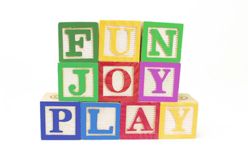Wooden Alphabet Blocks on Isolated White Background