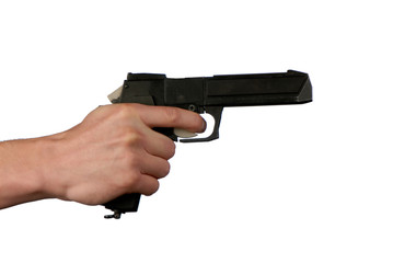 pistol in hand on white background, close-up