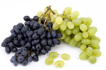 two bunches of red and white grapes on white background