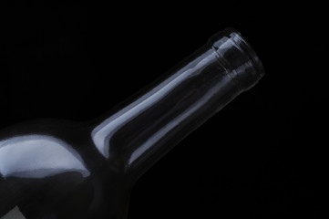 top of a wine bottle on a black background