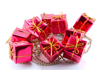 Small gift boxes with a chain on a white background
