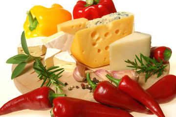 Cheese and herbs on a wooden board. Food photography.