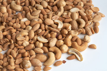 Mixed nuts and almonds close up with white background