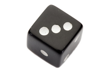 Black dice with number three a over white background